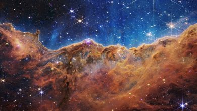 Webb’s Cosmic Cliffs in NGC 3324, using assigned colours to display infrared observations.